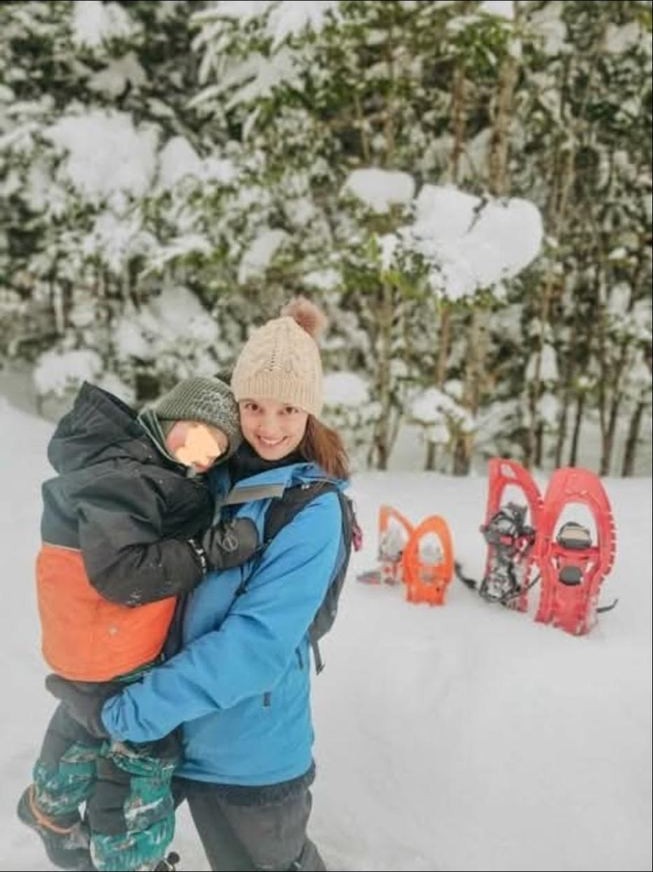The boys playing outside on five acres in winter